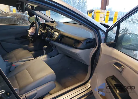 2011 Honda Insight from USA, damaged, VIN JHMZE2H32BS001076